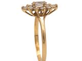 a close up of a gold ring with diamonds on it
