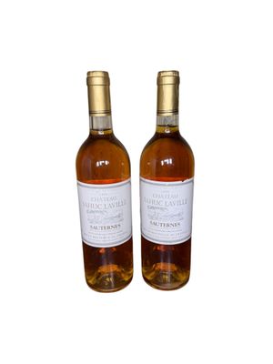 two bottles of wine sitting next to each other on a white surface