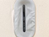 a toothbrush sitting on top of a white cloth