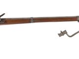 a close up of a rifle on a white background with a hook