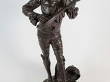 statue of a man with a gun and a dog on a white background
