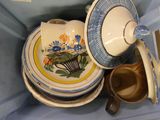 a tea pot and a plate in a blue box