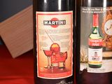 two bottles of wine sitting next to each other on a table
