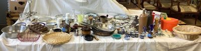 a table that has a lot of silver items on it