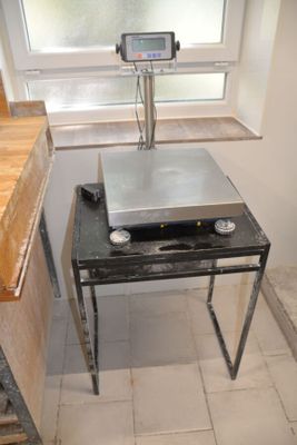 a scale sitting on a table in a small room