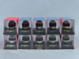 six boîtes contenant chacune des casques de course miniatures