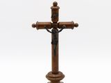 wooden crucift with a cross on a white background