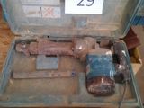 a tool in a case that is sitting on a table