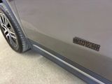 a close up of a car door with a sticker on it