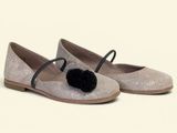 silver glitter ballerinas with black pom pom on the toe