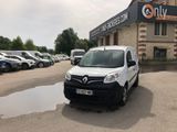 a white van that is parked in front of a building
