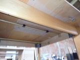 a picture of a wooden ceiling with a metal rail