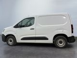 a picture of a white van parked in a room