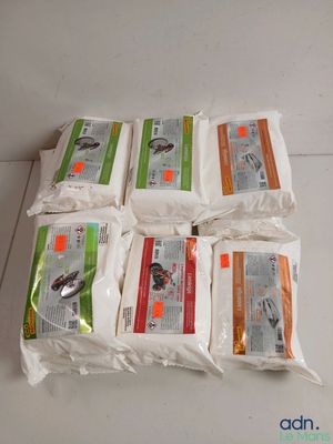 several bags of rice sitting on top of a white counter