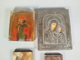 three small wooden plaques with religious images on them on a white surface