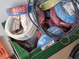 a box full of wires and other electrical equipment on the floor