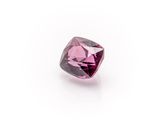 a pink diamond on a white surface with a white background