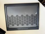 a laptop computer sitting on top of a table