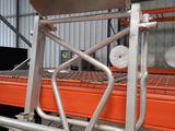 a chair that is sitting on a cart in a warehouse