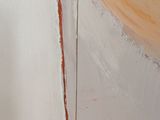 a close up of a painting of an orange and white circle
