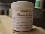 a jar of cream sitting on top of a cardboard box