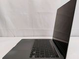 an open laptop computer sitting on top of a white table