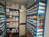 a room filled with lots of boxes and boxes on the shelves