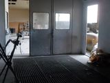 a room that has two doors and a chair in it