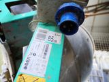 a close up of a blue and green water pump