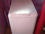 a white washer and dryer in a small room