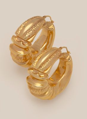 two gold hoop earrings on a white background