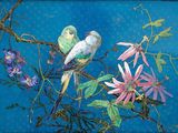 two birds sitting on a branch of a tree with flowers