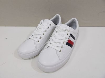white leather sneakers with red, white and blue stripes