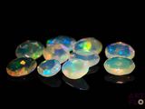some very pretty white oplites on a black surface