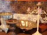 many different types of vases sitting on a table