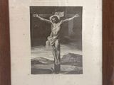 painting of jesus on the cross in a wooden frame on a wall