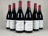 six bouteilles de vin rouge alignées