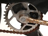 a close up of a bike with a chain attached to it
