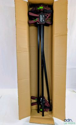a cardboard box with a pair of skis in it