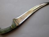 a knife that is laying on a table