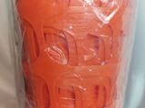 a plastic container with a carrot inside of it