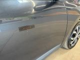 a close up of a car door with a sticker on it