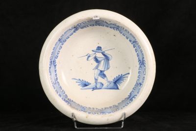a blue and white plate with a bird on it