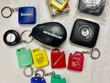 many different keys and keychains that are on a table