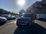 cars parked in a parking lot in front of a building