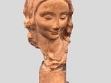 statue of a woman ' s head with a scarf on her head