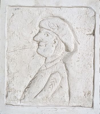 relief of a man with a hat and a cigarette in his mouth