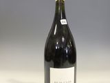 a bottle of wine that is sitting on a counter