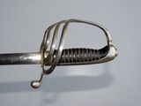 a close up of a sword with a metal handle