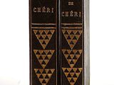 the two books are sitting side by side on a white surface